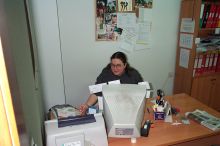 Christina, an insturctor, looking for the last bit of information for one of the afternoon literature conferences.