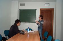 Inez, an instructor, providing additional guidance to Yuki, verde.