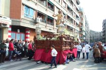 Christ has risen paso stopping for a rest.  Costaleros resting underneath & the support crew checking on them.