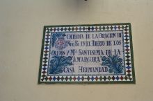 This is the name of one of the organizations that put on the processions.  The passo for this group is decorated with hand carved wood.  It is still in progress.