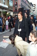 Another little girl working on her wax ball.  This gives the kids something to do while they are standing for HOURS waiting for the processions.