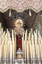A close up of a virgin on her float in the church before the procession.