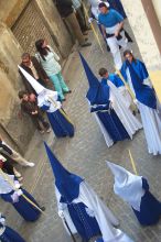 This was the first procession of the season.  That is why they are carrying a key.  In this procession many of the hooded marchers were children.
